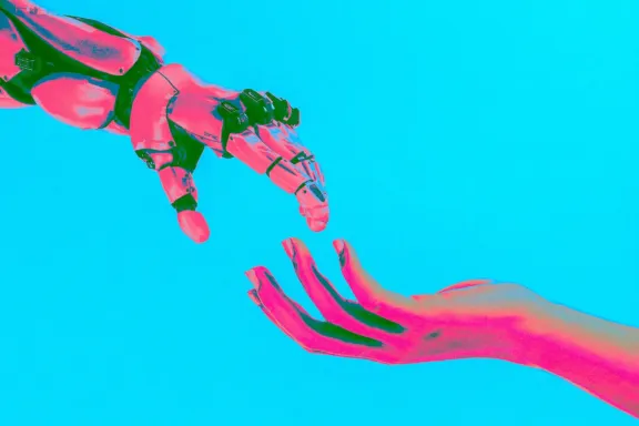 mano umana e mano di robot che si avvicinano